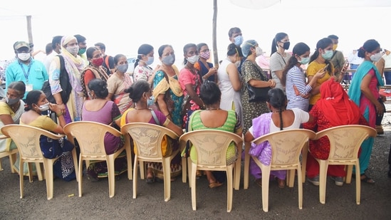 People queue while flouting social distancing norms, to get vaccinated against coronavirus disease (Covid-19), during the second phase of the countrywide inoculation drive, at BKC in Mumbai on March 2. Maharashtra on March 3 reported 9,855 Covid-19 infections, its highest single-day spike since October 17.(PTI )