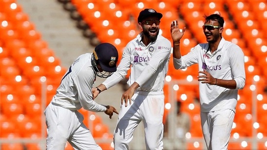 India's Shubman Gill, captain Virat Kohli and Axar Patel celebrate the dismissal of England's Dan Lawrence. (REUTERS)