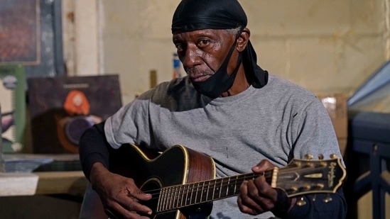 Bluesman Jimmy "Duck" Holmes plays a quick ditty at the Blue Front Cafe in Bentonia, Miss., Jan. 21, 2021. Holmes' ninth album, "Cypress Grove," has earned a Grammy nomination for the Best Traditional Blues Album.(AP) Bluesman Jimmy "Duck" Holmes plays a quick ditty at the Blue Front Cafe in Bentonia, Miss., Jan. 21, 2021. Holmes' ninth album, "Cypress Grove," has earned a Grammy nomination for the Best Traditional Blues Album.(AP)