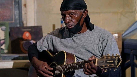 Bluesman Jimmy "Duck" Holmes plays a quick ditty at the Blue Front Cafe in Bentonia, Miss., Jan. 21, 2021. Holmes' ninth album, "Cypress Grove," has earned a Grammy nomination for the Best Traditional Blues Album. (AP)