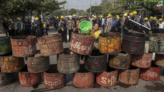 People build barricades to deter security personnel from entering a protest area in Mandalay on March 4. Yangon reported the highest death toll for March 3, where an estimated 18 people died. Most if not all of the deaths occurred in the eastern neighbourhood of North Okkalapa.(AP)