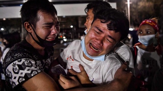 Burmese migrants living in Thailand break down during a memorial to honour those who died during demonstrations against the military coup in their homeland, in Bangkok on March 4. As part of the crackdown, security forces have arrested well over a thousand people, including journalists, AP reported citing the independent Assistance Association for Political Prisoners record.(Lillian Suwanrumpha / AFP)