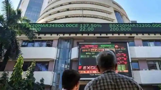 People watch the Sensex on a screen outside Bombay Stock Exchange (BSE) in Mumbai. (PTI File Photo)