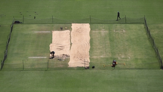 Pitch area is seen covered ahead of the fourth test cricket match between India and England at Narendra Modi Stadium in Ahmedabad.(AP) Pitch area is seen covered ahead of the fourth test cricket match between India and England at Narendra Modi Stadium in Ahmedabad.(AP)