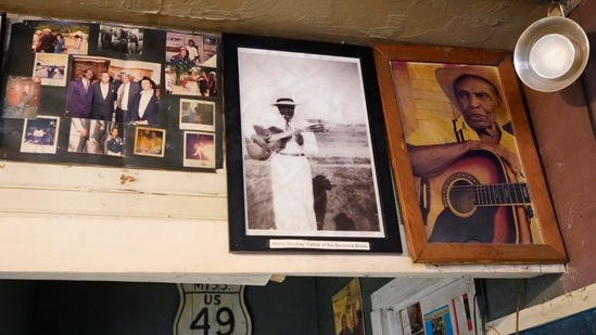 Portraits of Henry Stuckey, the originator of the Bentonia blues, second from right, and area resident and bluesman Jack Owens, hang high on the wall at the Blue Front Cafe in Bentonia, Miss., Jan. 21, 2021. Blues performer Jimmy "Duck" Holmes credits both Stuckey and Owens for having influenced his adoption of the Bentonia style of blues playing. Holmes' ninth album, "Cypress Grove," has earned a Grammy nomination for the Best Traditional Blues Album.(AP)
