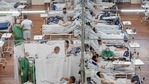 Covid-19 patients lie on beds at a field hospital built inside a sports coliseum in Santo Andre, on the outskirts of Sao Paulo, Brazil, Thursday,(AP) Covid-19 patients lie on beds at a field hospital built inside a sports coliseum in Santo Andre, on the outskirts of Sao Paulo, Brazil, Thursday,(AP)