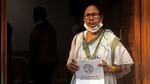 Chief minister of West Bengal Mamata Banerjee holds the list of electoral candidates outside the Trinamool Congress party office ahead of the state legislative assembly elections in Kolkata on March 5, 2021. (AFP)