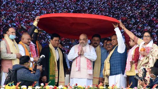 Union minister Amit Shah being felicitated with a huge traditional Assamese Japi (hat) by Assam chief minister Sarbananda Sonowal, and others during BJP's public rally, at Kendukuchi in Nalbari district earlier this year. (File photo) Union minister Amit Shah being felicitated with a huge traditional Assamese Japi (hat) by Assam chief minister Sarbananda Sonowal, and others during BJP's public rally, at Kendukuchi in Nalbari district earlier this year. (File photo)