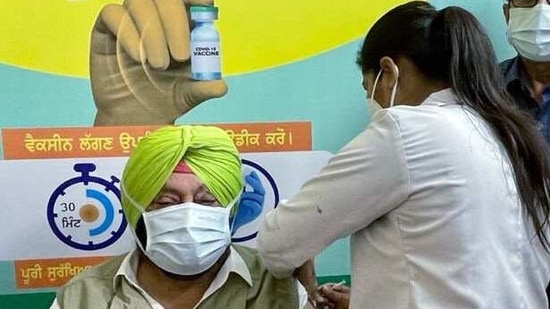 Punjab CM Captain Amarinder Singh takes his first dose of the Covid-19 vaccine, at Civil Hospital in Mohali on Friday. (ANI)