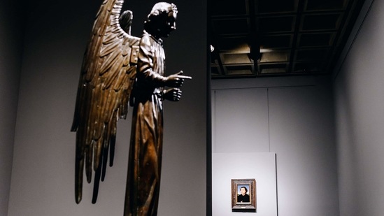 An early Netherlandish painting from 1440 to 1570, right, past the "Barbet Angel" cast in 1475 by Jean Barbet at the Frick Collection's new museum location on Madison Avenue in New York, U.S., on Tuesday, March 2, 2021. (Bloomberg)