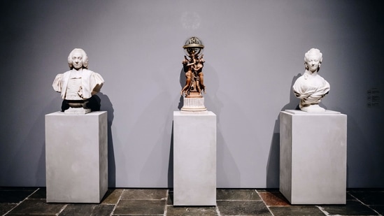 Eighteenth-century French busts on either side of the so-called Clodion clock at the entrance to the fourth-floor galleries at the Frick Collection's new museum location on Madison Avenue in New York, U.S., on Tuesday, March 2, 2021.(Bloomberg)