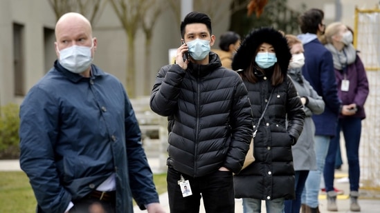 Healthcare workers wait in line to receive the Pfizer-BioNTech Covid-19 vaccine at a vaccination clinic in Vancouver, British Columbia, Canada, on Thursday, March 4, 2021. The Canadian minister in charge of vaccines said it�s "highly likely" the government will be able to move up its target date for inoculating every citizen who wants a Covid-19 shot. Photographer: Jennifer Gauthier/Bloomberg(Bloomberg) Healthcare workers wait in line to receive the Pfizer-BioNTech Covid-19 vaccine at a vaccination clinic in Vancouver, British Columbia, Canada, on Thursday, March 4, 2021. The Canadian minister in charge of vaccines said it�s "highly likely" the government will be able to move up its target date for inoculating every citizen who wants a Covid-19 shot. Photographer: Jennifer Gauthier/Bloomberg(Bloomberg)