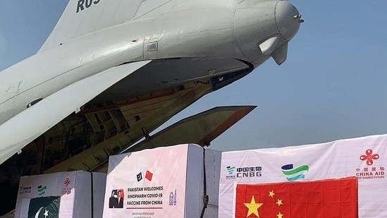 In picture - The first batch of Covid-19 vaccine boxes unloaded from a Pakistan's air force plane after arriving from China at the Nur Khan military airbase in Islamabad.(AFP)