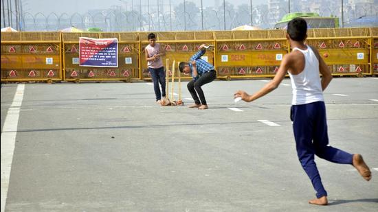 Children play cricket during the ongoing protest against the new farm laws, at Ghazipur (Delhi-UP border), near Ghaziabad, on Thursday. (Sakib Ali/HT Photo) Children play cricket during the ongoing protest against the new farm laws, at Ghazipur (Delhi-UP border), near Ghaziabad, on Thursday. (Sakib Ali/HT Photo)