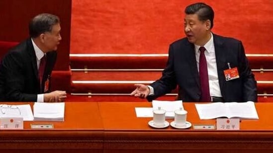 While officials seated in the rows behind them were all masked, Xi and Chinese Premier Li Keqiang moved around the Great Hall of the People, where the National People’s Congress is opened every year, mask-free. (AP Photo/Andy Wong)(AP) While officials seated in the rows behind them were all masked, Xi and Chinese Premier Li Keqiang moved around the Great Hall of the People, where the National People’s Congress is opened every year, mask-free. (AP Photo/Andy Wong)(AP)