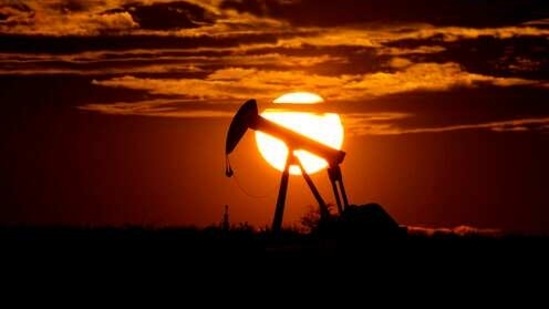 FILE - In this Wednesday, April 8, 2020, file photo, the sun sets behind an idle pump jack near Karnes City, USA. Members of oil producer cartel OPEC and allied countries are meeting online Thursday March 4, 2021, considering a possible increase in production now that prices have recovered to near their pre-pandemic levels. (AP Photo/Eric Gay, File)(AP)