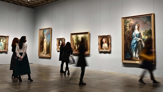 People look paintings during the Frick Collection opening press preview at Frick Madison in the Marcel Breuer building on March 4, 2021 in New York City. - The Frick's permanent collection features old Master paintings and European fine and decorative arts, including works by Bellini, Fragonard, Goya, Rembrandt, Turner, Velazquez and Vermeer. (Photo by Angela Weiss / AFP)(AFP) People look paintings during the Frick Collection opening press preview at Frick Madison in the Marcel Breuer building on March 4, 2021 in New York City. - The Frick's permanent collection features old Master paintings and European fine and decorative arts, including works by Bellini, Fragonard, Goya, Rembrandt, Turner, Velazquez and Vermeer. (Photo by Angela Weiss / AFP)(AFP)