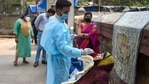 A health worker takes swab sample of a resident for Covid-19 testing in a housing society amid a surge in coronavirus cases in Mumbai. (PTI File Photo ) A health worker takes swab sample of a resident for Covid-19 testing in a housing society amid a surge in coronavirus cases in Mumbai. (PTI File Photo )
