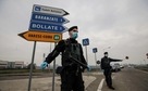 Carabinieri officers patrol one of the main access road to Bollate, in the outskirts of Milan, Italy.(AP) Carabinieri officers patrol one of the main access road to Bollate, in the outskirts of Milan, Italy.(AP)