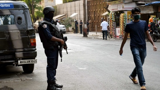 High security outside Antilia at Altamont road after a car laden with gelatin sticks has been found abandoned near billionaire Mukesh Ambani's Antilia residence in Mumbai on Friday. (ANI Photo) High security outside Antilia at Altamont road after a car laden with gelatin sticks has been found abandoned near billionaire Mukesh Ambani's Antilia residence in Mumbai on Friday. (ANI Photo)