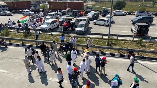 Farmers blocking the KMP Expressway near Dasna, Ghaziabad on the 100th day of their protest on March 6. Prime Minister Narendra Modi’s government says the laws are necessary to modernise agriculture but farmers say they will leave them poorer and at the mercy of big corporations.(Arun Sharma/PTI)