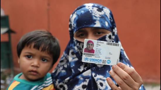 A Rohingya woman shows her UN-issued refugee card in Jammu on Saturday. (HT PHOTO) A Rohingya woman shows her UN-issued refugee card in Jammu on Saturday. (HT PHOTO)