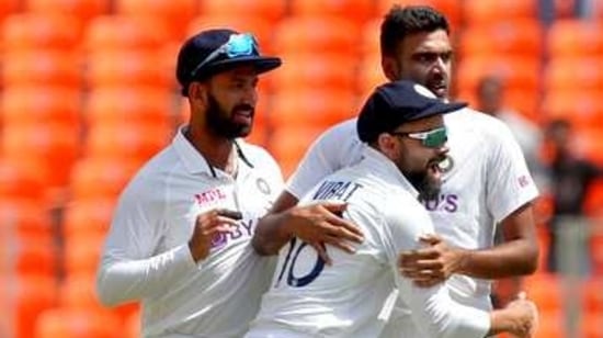 India's captain Virat Kohli, center, hugs to congratulate teammate Ravichandran Ashwin, right, on dismissing England's Zak Crawley(AP) India's captain Virat Kohli, center, hugs to congratulate teammate Ravichandran Ashwin, right, on dismissing England's Zak Crawley(AP)