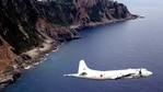 In this file photo, a P-3C patrol plane of Japanese maritime self defense force flying over the disputed islets known as the Senkaku islands in Japan and Diaoyu islands in China in the East China Sea. (AFP Photo)