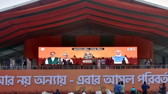 BJP workers decorate the rally and stage area ahead of PM Narendra Modi's election rally at the brigade parade ground, in Kolkata.(ANI) BJP workers decorate the rally and stage area ahead of PM Narendra Modi's election rally at the brigade parade ground, in Kolkata.(ANI)