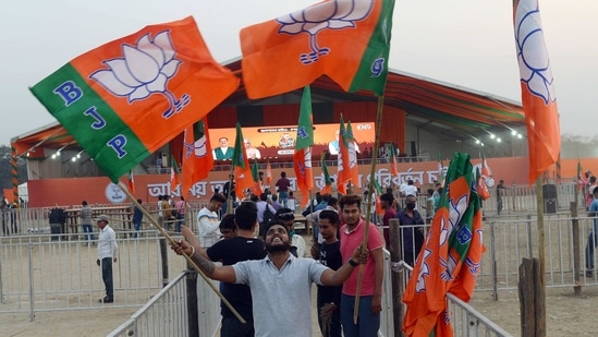 BJP activists cheer holding party flags at the rally and stage area ahead of PM Narendra Modi's election rally at the brigade parade ground, in Kolkata. BJP activists cheer holding party flags at the rally and stage area ahead of PM Narendra Modi's election rally at the brigade parade ground, in Kolkata.
