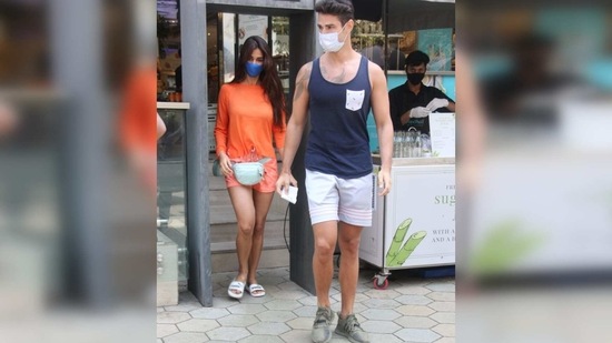 The Bharat actor chose a full-sleeved baggy orange top and teamed it with a pair of matching mini shorts.(Varinder Chawla)