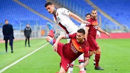 Roma's Lorenzo Pellegrini, foreground is challenged by Genoa's Gianluca Scamacca during the Serie A soccer match between Roma and Genoa at the Rome Olympic Stadium Sunday, March 7, 2021. (AP)