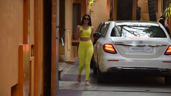 She teamed the sports bra with a pair of matching Yoga pants and completed the ensemble with black sunnies and chappals.(Varinder Chawla)