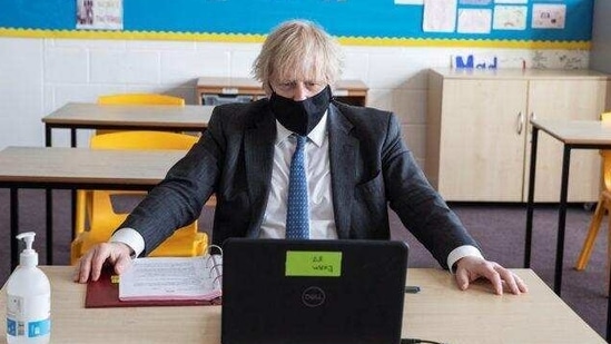 British Prime Minister Boris Johnson takes part in an online class during his visit to the Sedgehill School, in London. (via Reuters) British Prime Minister Boris Johnson takes part in an online class during his visit to the Sedgehill School, in London. (via Reuters)
