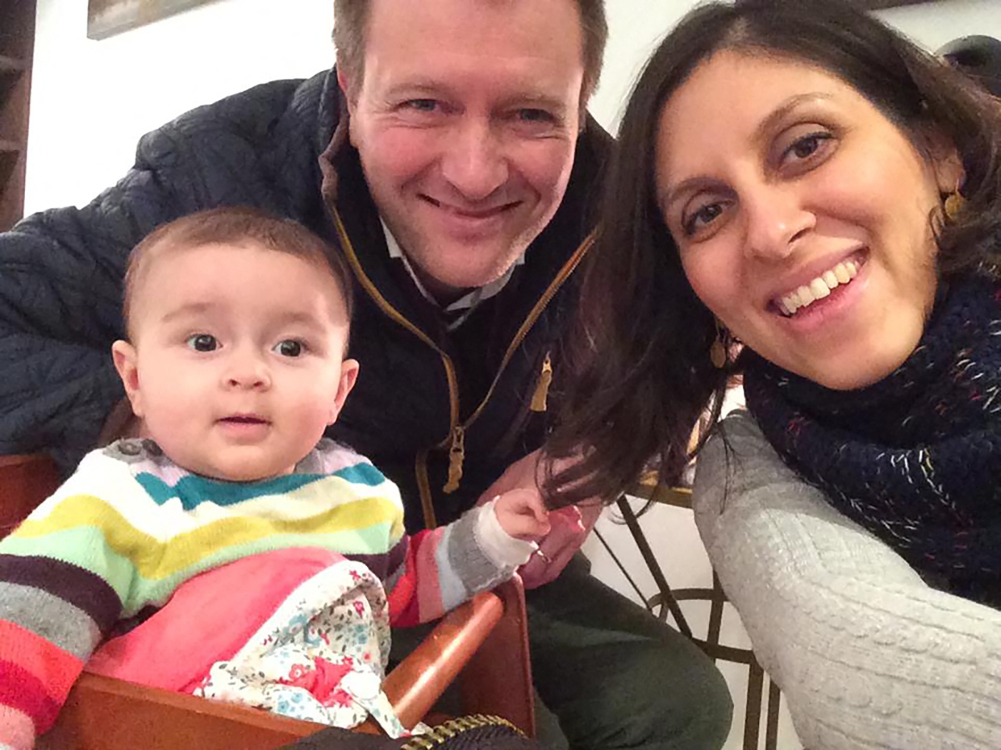 An undated image shows Nazanin Zaghari-Ratcliffe (R) posing for a photograph with her husband Richard and daughter Gabriella (L).(AFP) An undated image shows Nazanin Zaghari-Ratcliffe (R) posing for a photograph with her husband Richard and daughter Gabriella (L).(AFP)
