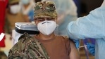 An Air Force member closes her eyes while getting a shot of Pfizer's vaccine for COVID-19 at a military base in Lima, Peru, Monday, March 8, 2021. (AP Photo/Martin Mejia)(AP) An Air Force member closes her eyes while getting a shot of Pfizer's vaccine for COVID-19 at a military base in Lima, Peru, Monday, March 8, 2021. (AP Photo/Martin Mejia)(AP)
