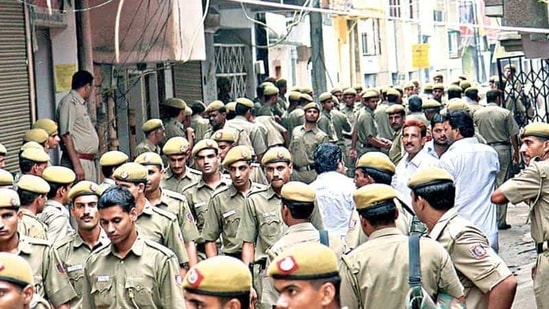 File photo of Delhi Police personnel at the spot, a day after the encounter. (Sunil Saxena/ HT Photo)