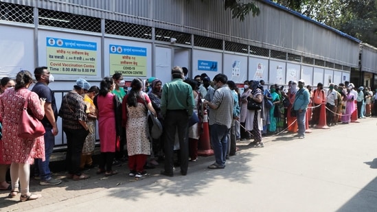 People wait in a queue to receive COVID-19 vaccination in Mumbai. (AP) People wait in a queue to receive COVID-19 vaccination in Mumbai. (AP)