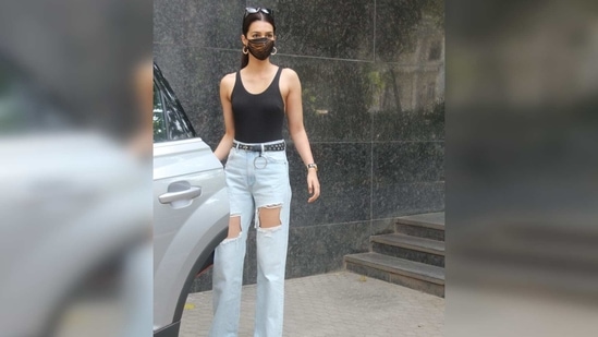 The Luka Chuppi actor was seen wearing a black spaghetti top with a pair of wide-legged distressed jeans.(Varinder Chawla)