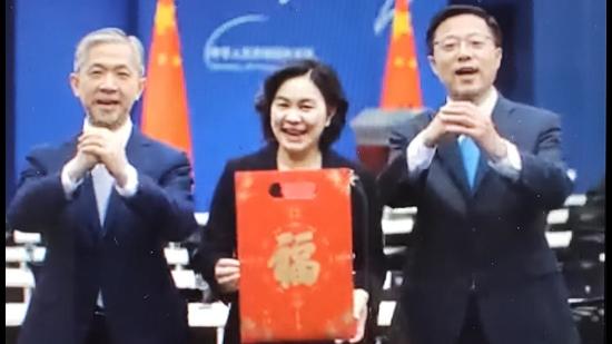 A screengrab of video shared media company CGTN on Twitter, from the Chinese foreign ministry, which shows spokespersons using the “fist and palm” salute to extend season’s greetings ahead of the Chinese New Year in February, 2021. (SCREENGRAB/ TWITTER) A screengrab of video shared media company CGTN on Twitter, from the Chinese foreign ministry, which shows spokespersons using the “fist and palm” salute to extend season’s greetings ahead of the Chinese New Year in February, 2021. (SCREENGRAB/ TWITTER)