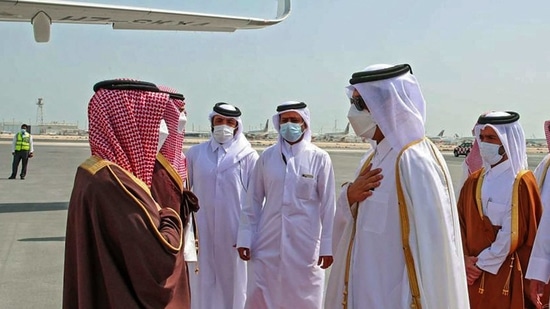 Qatar's Foreign Minister Sheikh Mohammed bin Abdulrahman Al-Thani (2nd-R) greeting Saudi Arabia's Foreign Minister Prince Faisal bin Farhan Al-Saud (L) upon arrival in Qatar.(AFP)