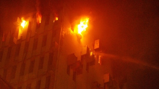 Fire fighters trying to control the blaze at a multi-storeyed building in Kolkata on Monday, (PTI) Fire fighters trying to control the blaze at a multi-storeyed building in Kolkata on Monday, (PTI)