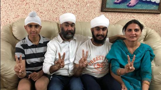 Guramrit Singh (second from right) celebrates with his family in Mohali on Monday. (HT Photo)