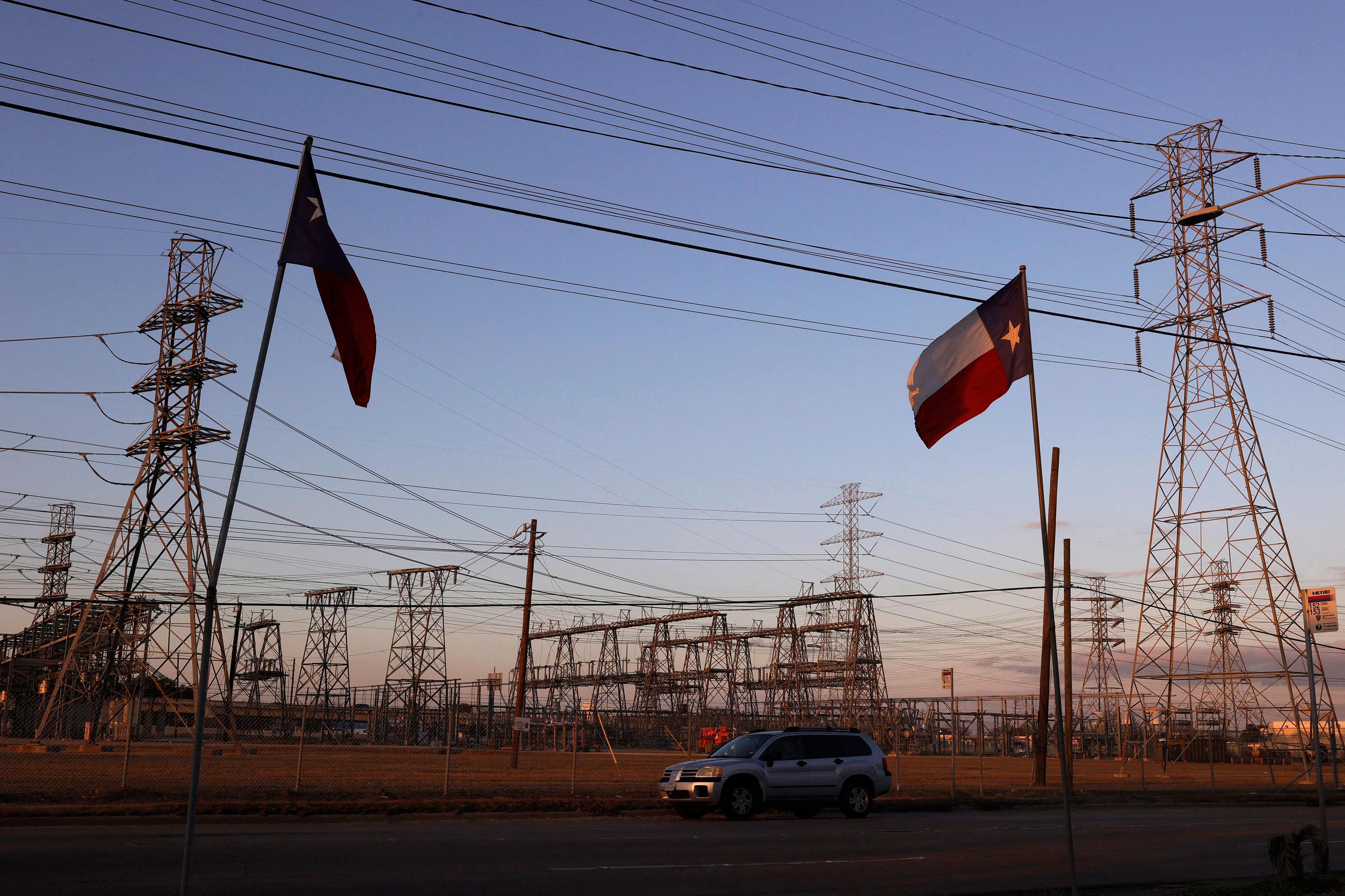 Texas flags fly near an electrical substation on February 21, 2021 in Houston, Texas. (AFP) Texas flags fly near an electrical substation on February 21, 2021 in Houston, Texas. (AFP)