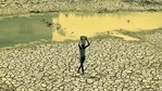 An Indian man carries a container of water on his head as he walks in a dry pond in a hot afternoon on the outskirts of Bhubaneswar in this file picture from 2014. (Arabinda Mahapatra/ Hindustan Times Archive) An Indian man carries a container of water on his head as he walks in a dry pond in a hot afternoon on the outskirts of Bhubaneswar in this file picture from 2014. (Arabinda Mahapatra/ Hindustan Times Archive)