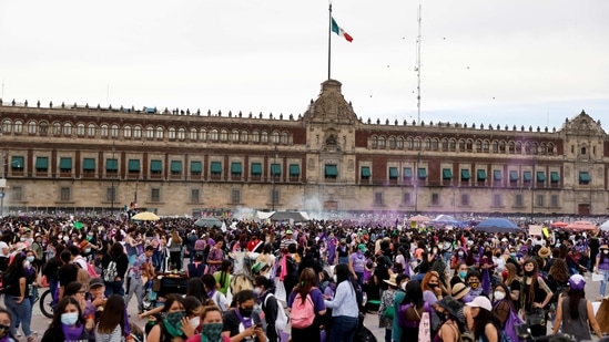 Women seen during a protest on International Women's Day, in front of the National Palace, in Mexico City, Mexico, on March 8. Women across Mexico took to the streets on March 8 to protest against violence faced by them daily, fueled by what they say is an out of touch government and President Andres Manuel Lopez Obrador's support for a politician accused of rape, Reuters reported.(Carlos Jasso / REUTERS)