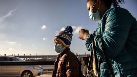 Immigrants walk across the Gateway International Bridge into Mexico after being sent out of Texas by US. (AFP) Immigrants walk across the Gateway International Bridge into Mexico after being sent out of Texas by US. (AFP)