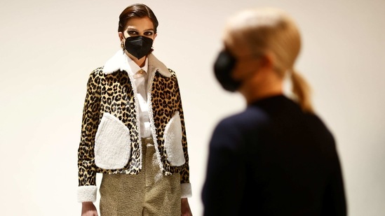 Maria Grazia Chiuri, designer for Fashion house Dior, poses with a model during an interview with Reuters ahead of her Fall/Winter 2021 collection presentation in a digital format during Paris Fashion week, in Aubervilliers, near Paris, France, March 6, 2021. Picture taken March 6, 2021. REUTERS/Christian Hartmann (REUTERS)