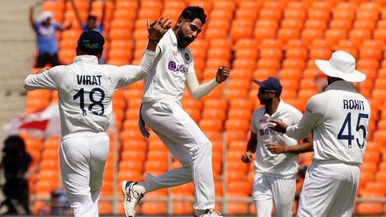 India's Mohammad Siraj celebrates a dismissal with teammates during the 4th Test Match between India and England at Narendra Modi Stadium in Ahmedabad on Thursday. (BCCI/ANI Photo)