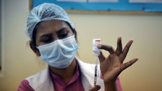 A medical worker fills the syringe with the Covid-19 vaccine to inoculate it to elderly people during the second phase of the Covid-19 vaccination at a hospital in New Delhi on Friday.(ANI Photo) A medical worker fills the syringe with the Covid-19 vaccine to inoculate it to elderly people during the second phase of the Covid-19 vaccination at a hospital in New Delhi on Friday.(ANI Photo)